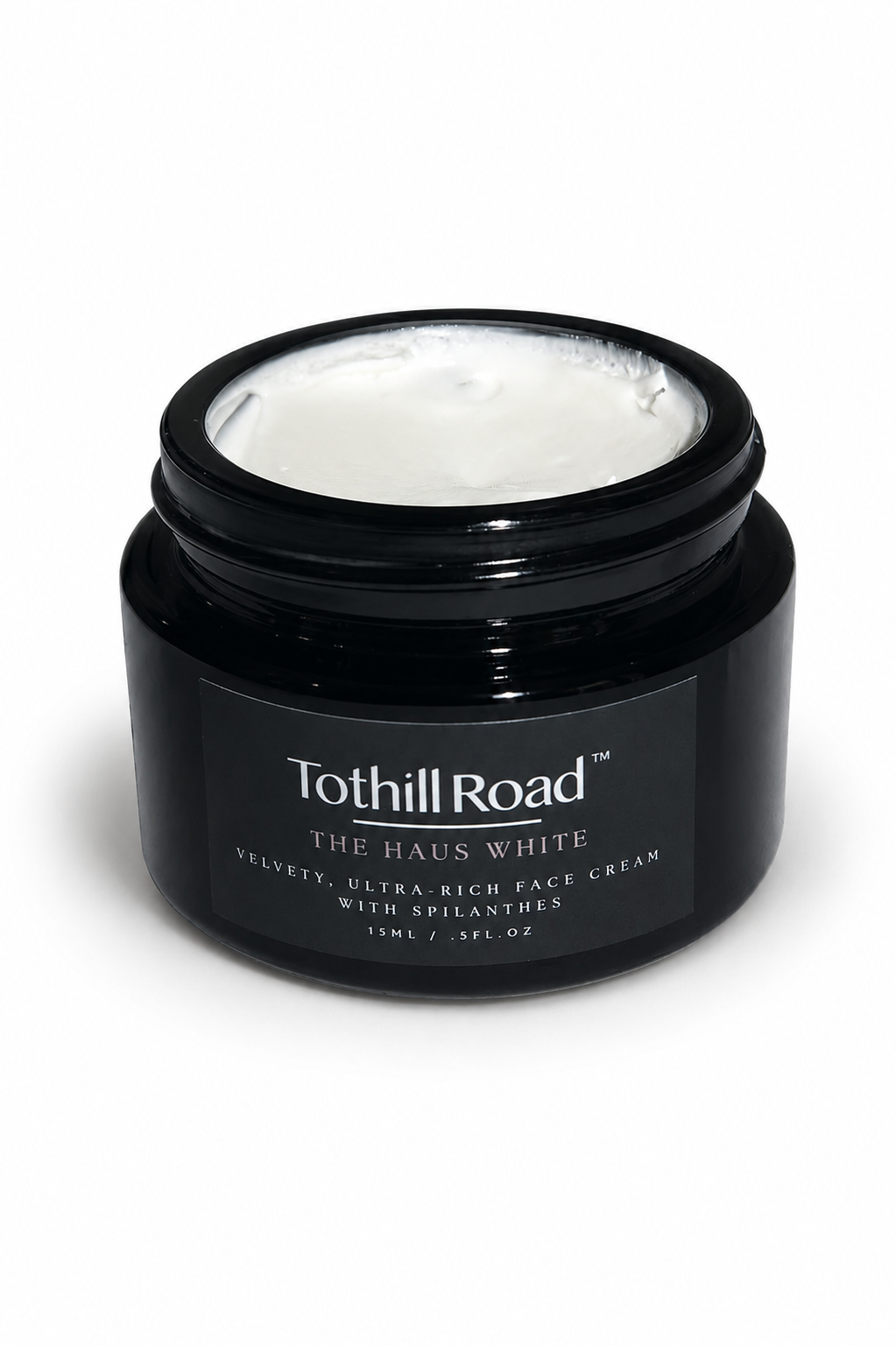 Black jar of Tothill Road Haus White cream on a white background